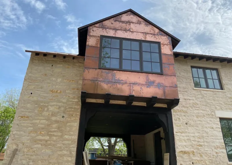 Copper metal panel facade on a stone building for Skylight Installation in Wickenburg